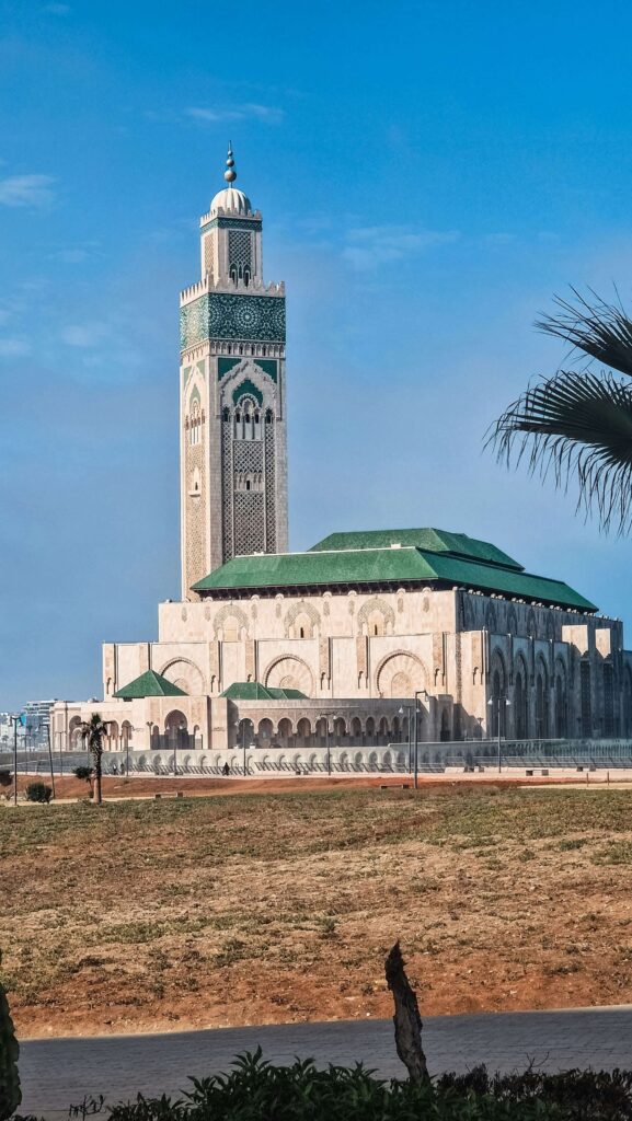 the iconic Hassan II Mosque in Casablanca, Morocco, with its stunning minaret and oceanfront location. top must see in africa